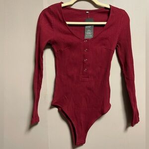 Queen M. Burgandy Ribbed Bodysuit. Size S, NWT